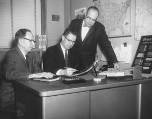 1953 - Left to right - Roy McClean, Sales Manager and Robert A. Boyd, Jr., President reviewing new marketing strategy.