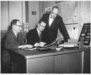 Left to right - Roy McClean, Sales Manager, Robert A. Boyd, Jr., President, and Herb DeRoth, General Manager, reviewing new marketing strategy.